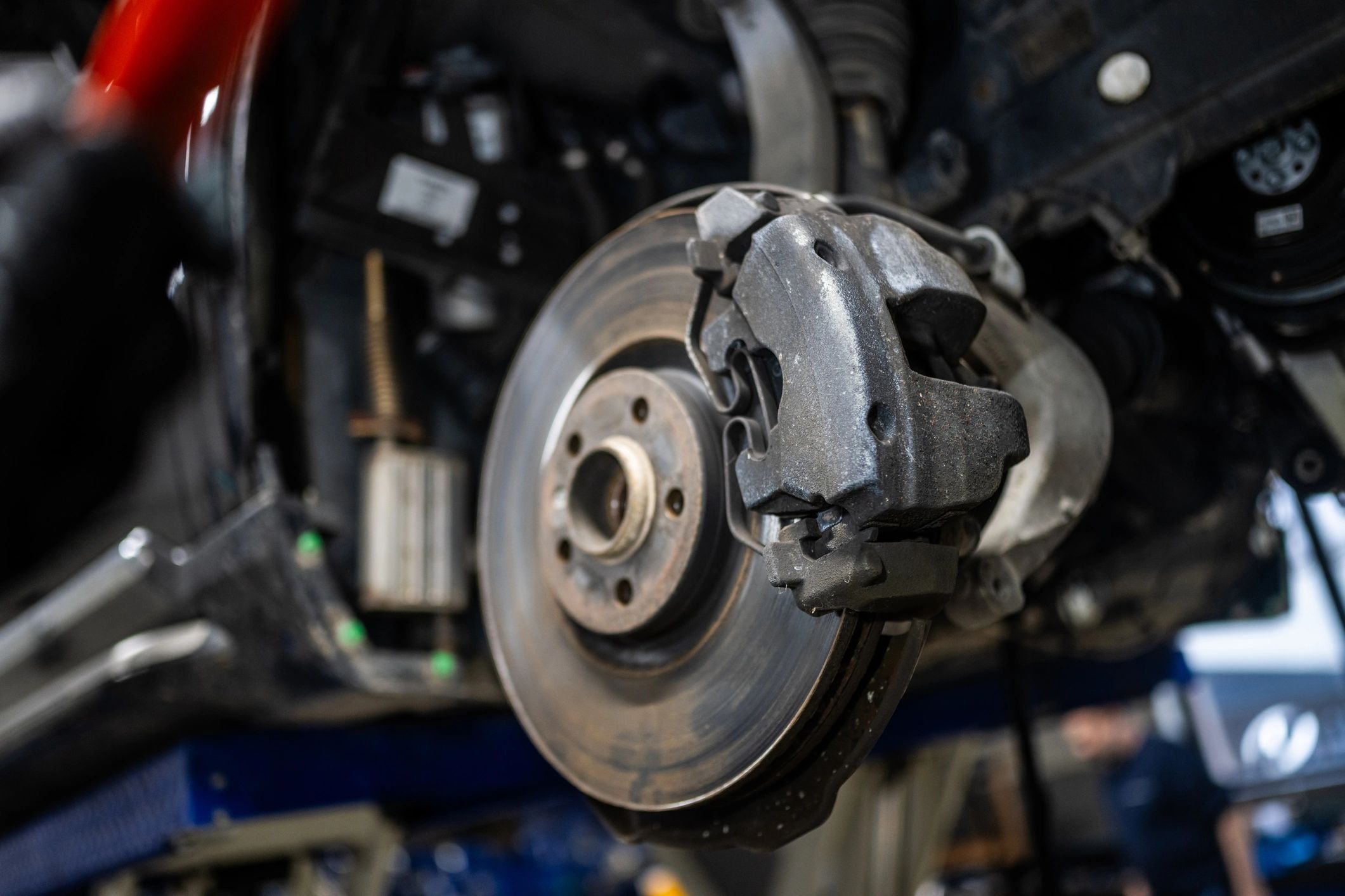Brake disc and caliper in a repair shop during inspection
