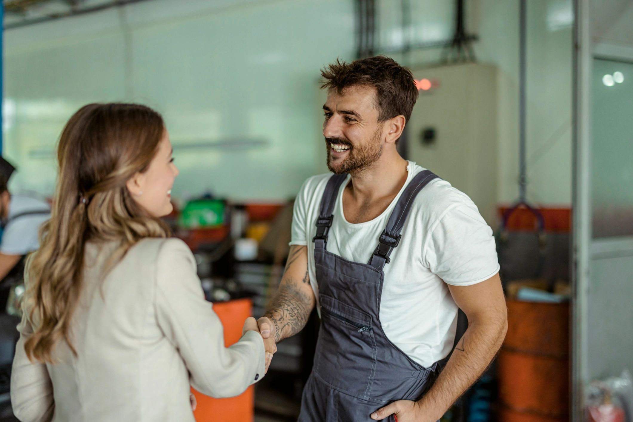 Mechanic and customer handshake after service